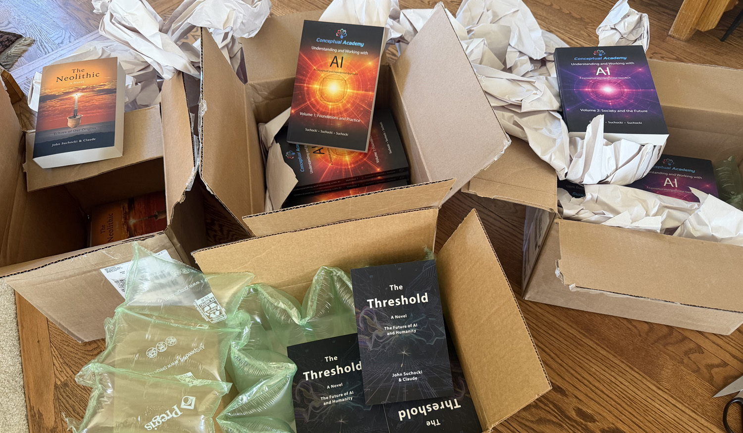 The four books freshly arrived from the printer